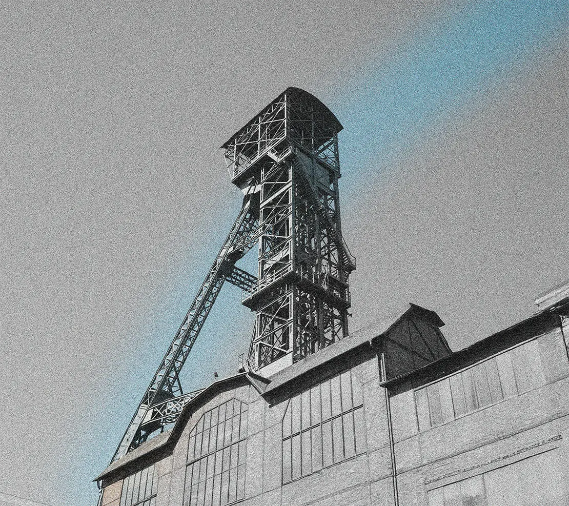 A image of a concrete sphere, balanced between two other larger spheres