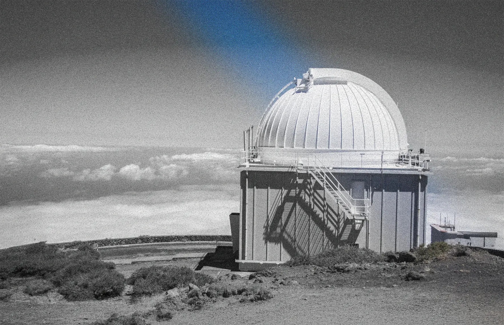 A image of a concrete sphere, balanced between two other larger spheres